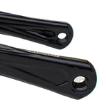 Close-up of black bicycle cranks on a white background
